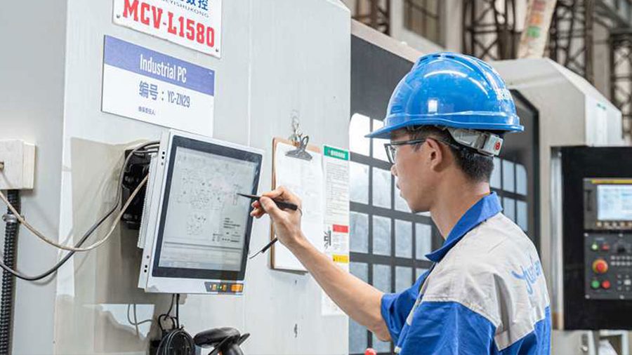Operator running a CNC machining center